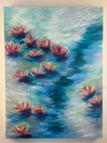 An impressionistic painting of water lilies on a pond, featuring pink and purple flowers with blue and green water reflections, displayed on a light beige wall.